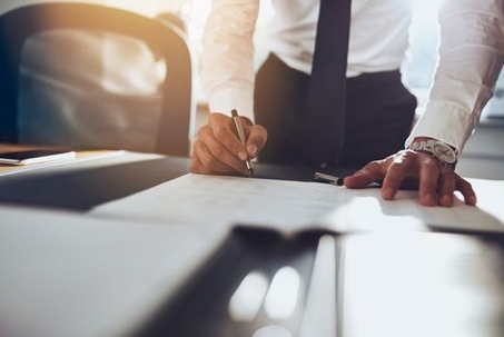 Man filling out legal documents